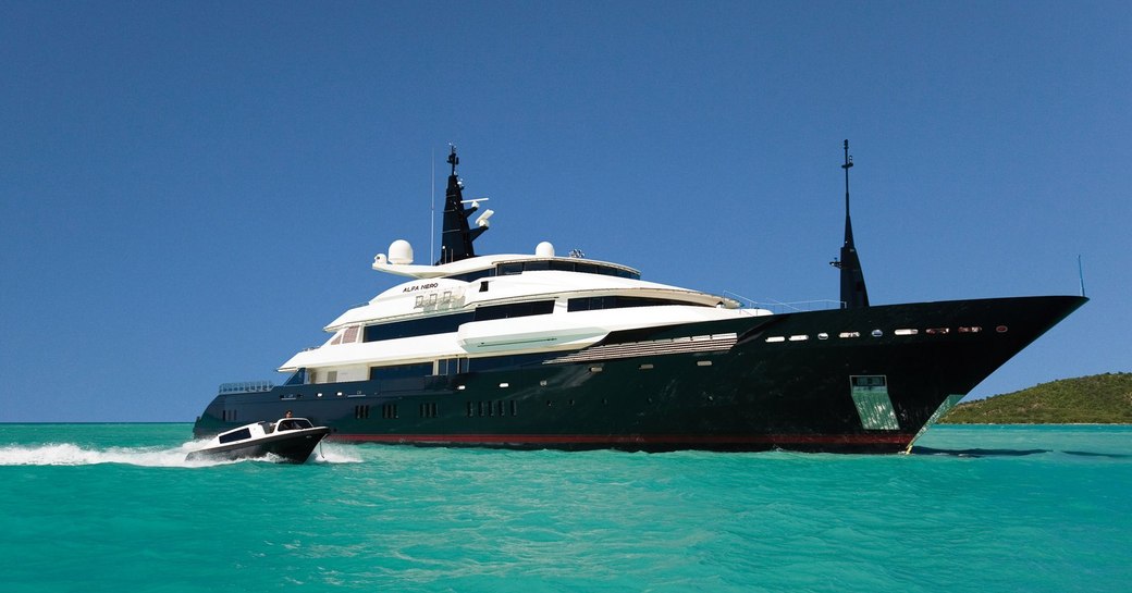 superyacht Alfa Nero underway alongside matching tender of a luxury yacht charter