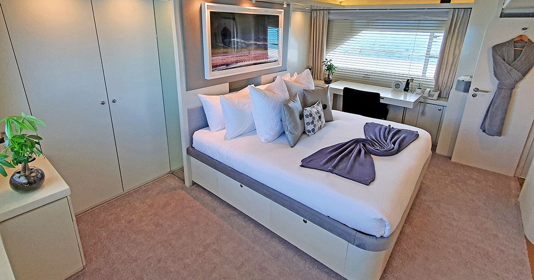 Double bed in cabin on superyacht LIONSHARE