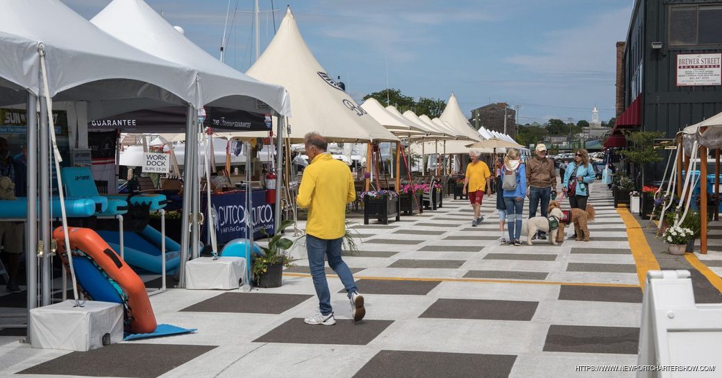 Line of exhibitors tents at the Newport Charter Yacht Show