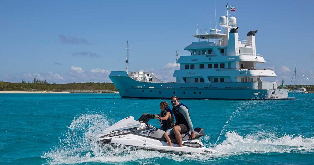 Couple of water toy in front of MARCATO explorer yacht