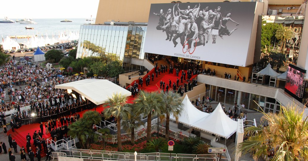 crowds gather around the red carpet at the Palais des Festivals for a premier at the Cannes Film Festival 