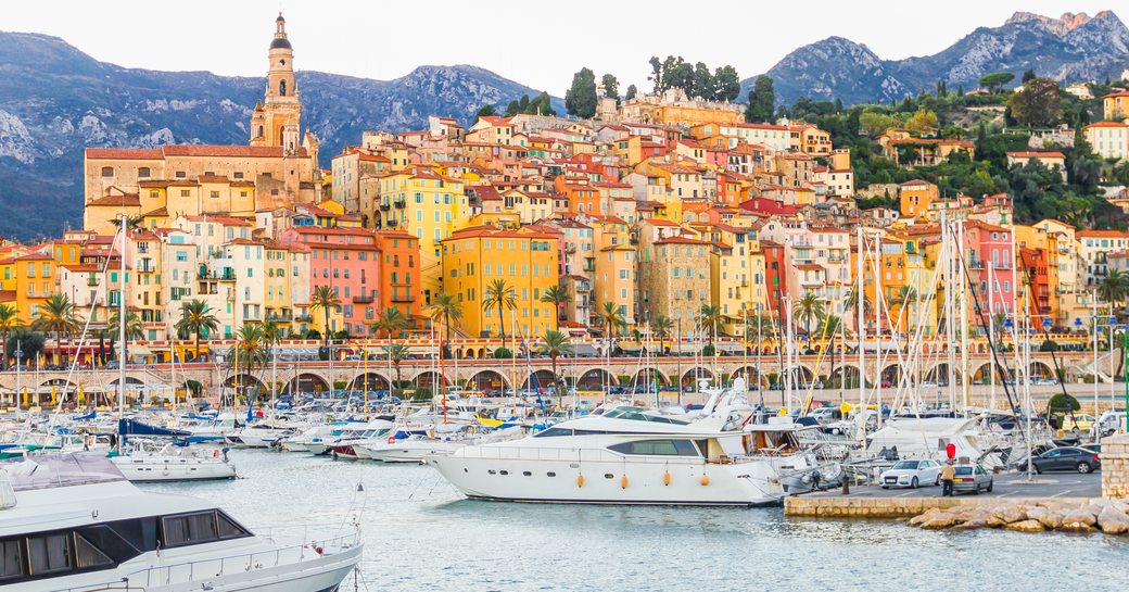 Yachts line the port in Menton, France