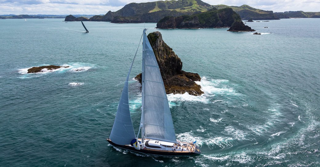 sailing yachts competing in the NZ Millennium Cup traverse through the Bay of Islands