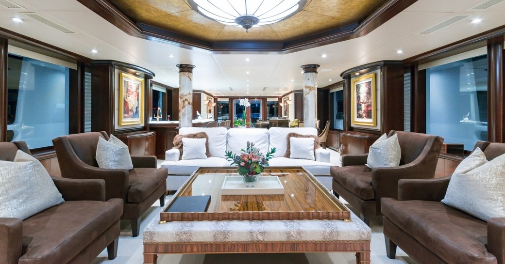 lavish main salon with mahogany wall panels in the main salon of charter yacht STARSHIP 