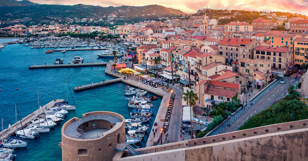Fantastic morning cityscape of Calvi port. Aerial summer sunrise on Corsica island, France, Europe. 