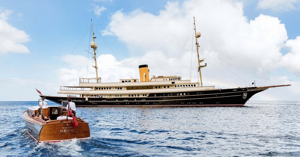 Charter yacht NERO at anchor in the sea with a tender on route 