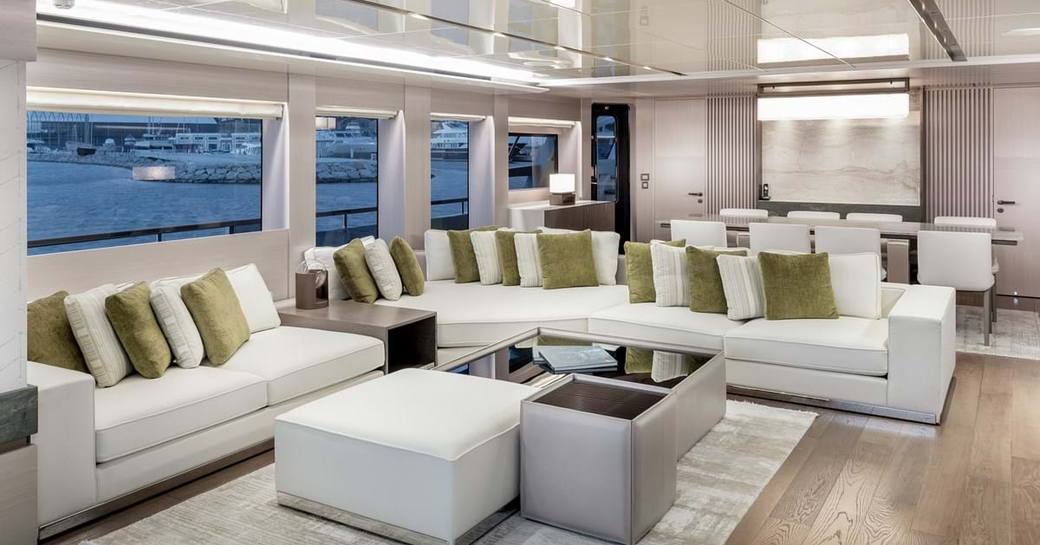 Main saloon on explorer yacht 'Seven Diamonds' with lightly colored sofas and tables