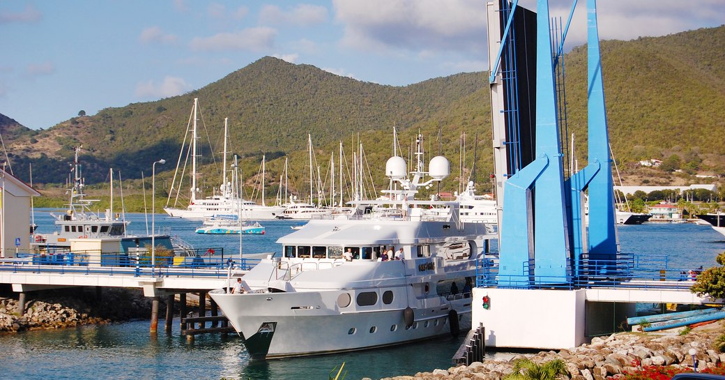 A chartered private luxury yacht leaving Isle de Sol through the Simpson Bay Drawbridge