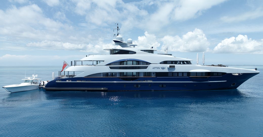 Charter yacht AFTER YOU at anchor with tender adjacent
