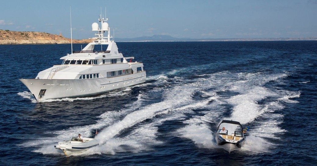 motor yacht MQ2 gets underway alongside tenders