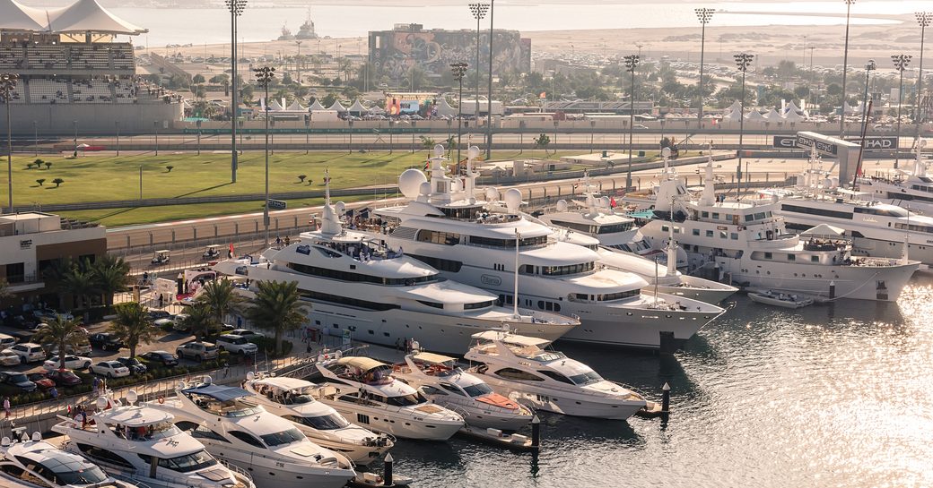 Superyachts at berth next to Abu Dhabi Grand Prix Yas Marina racing circuit