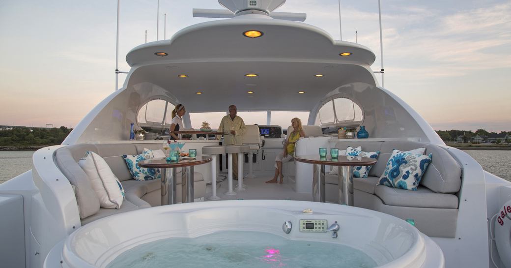 charter guests are served drinks at the bar on the sundeck of superyacht ‘Gale Winds’ 