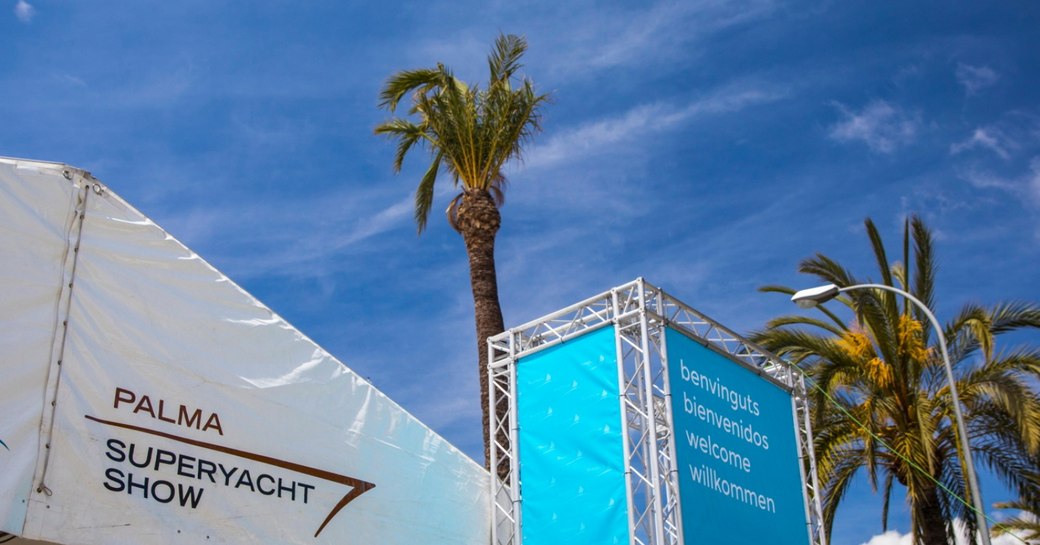 Exhibitors tent and palm trees at the Palma Superyacht Show