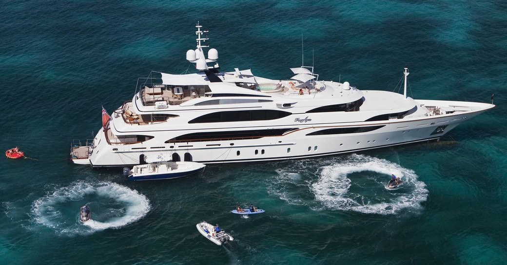 superyacht JAGUAR anchors in the Caribbean alongside her water toys