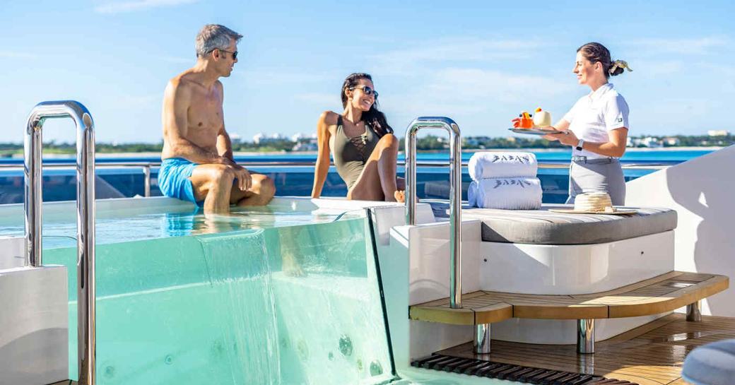 Guests enjoy the Jacuzzi on board charter yacht BABA'S