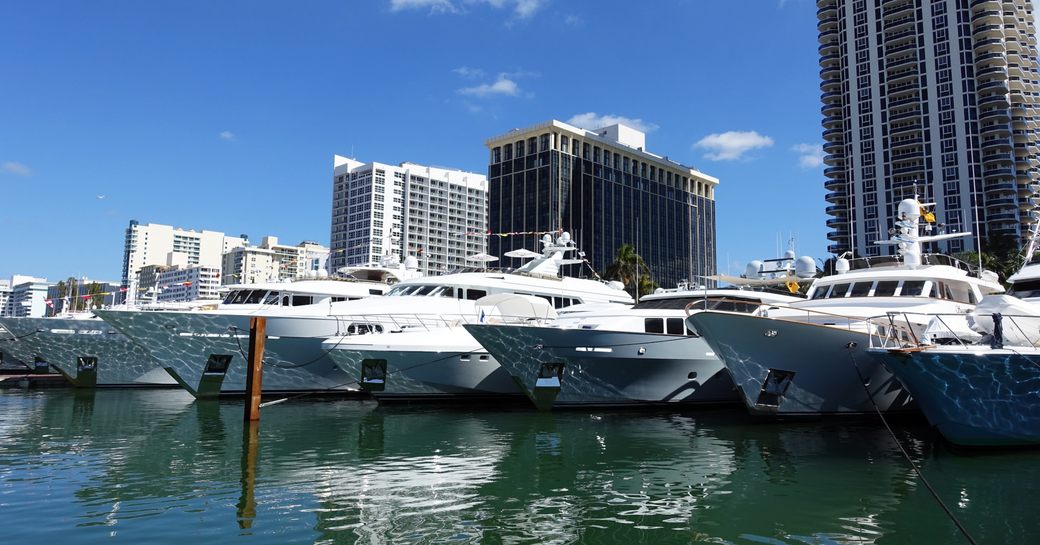 yachts lined up at the Miami Yacht Show @ Collins Avenue