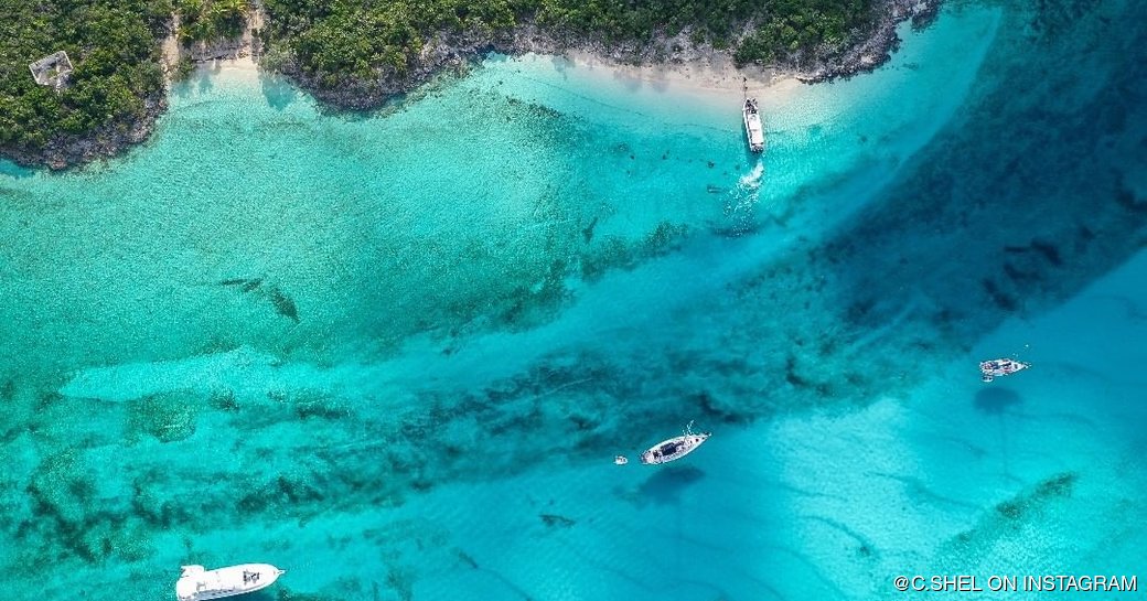 Aerial view of the yachts on the water in Allen's Cay 