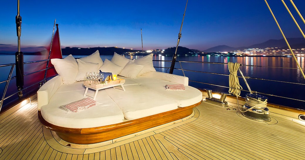 glasses laid out for drinks on the aft deck of superyacht REGINA as the sun sets