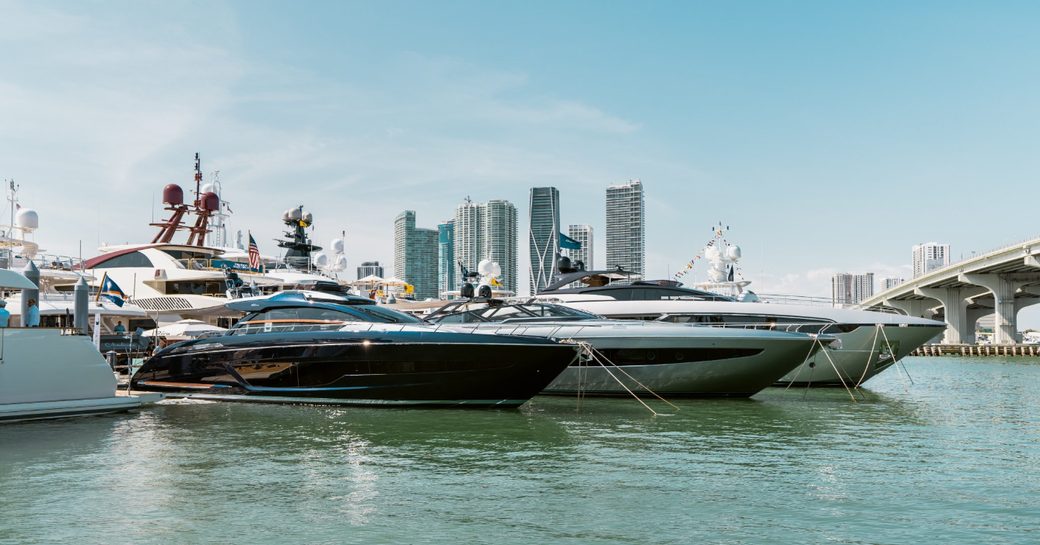 yachts line up for the Miami Yacht Show 2019 with skyscrapers in the background