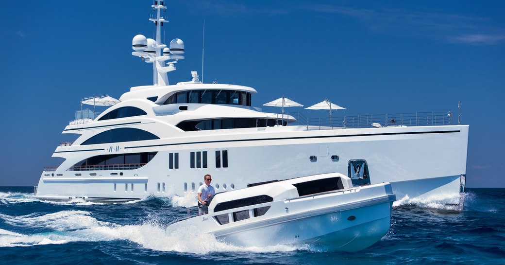 superyacht 11/11 cruises alongside custom limo tender