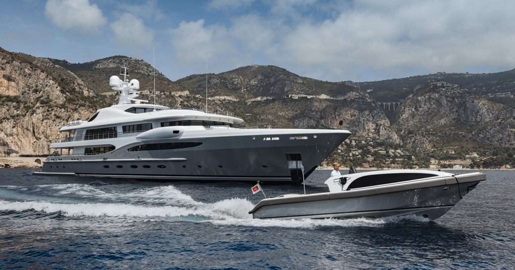Charter yacht VENTUM MARIS and tender at sea