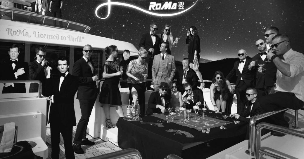 Crew on board charter yacht ROMA for a promotional poster with James Bond theme