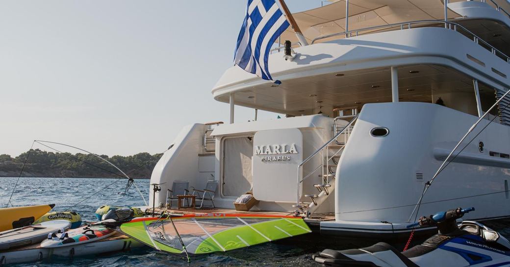 Aft view and water toys deployed with luxury yacht rental MARLA