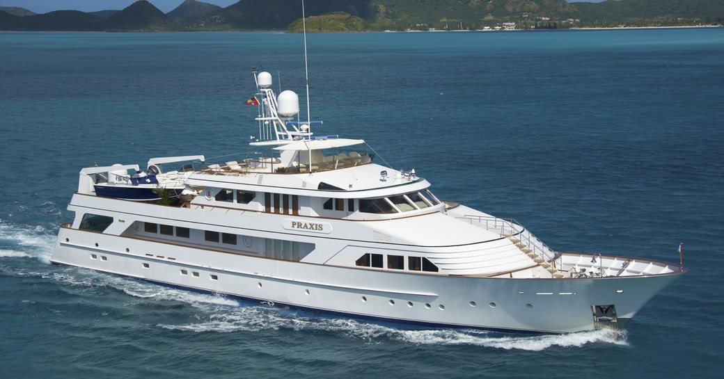 superyacht PRAXIS cuts through the water on a luxury yacht charter in New England