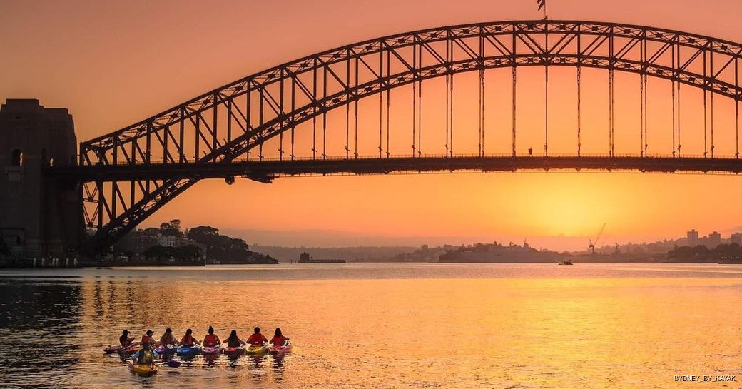 kayaks watching the sunrise on sydney harbour