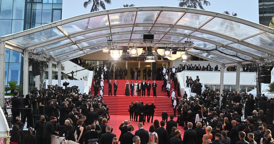 The iconic red carpeted stairs of the Cannes Film Festival awash with paparazzi and A-listers
