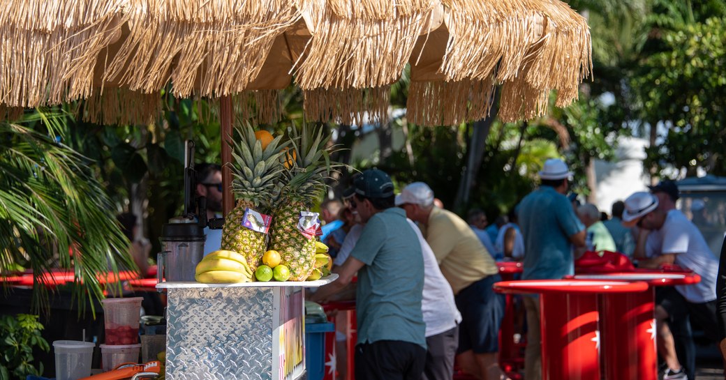 Men around food outlet at FLIBS