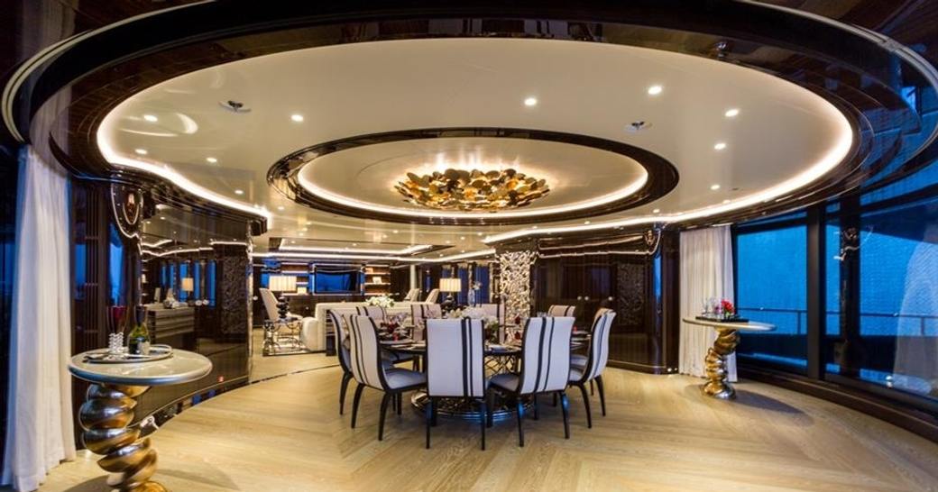 inside-outside dining on the aft deck of motor yacht OKTO 