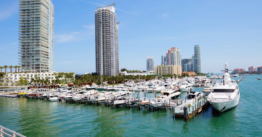 Motor yacht charters berthed in a marina in Miami