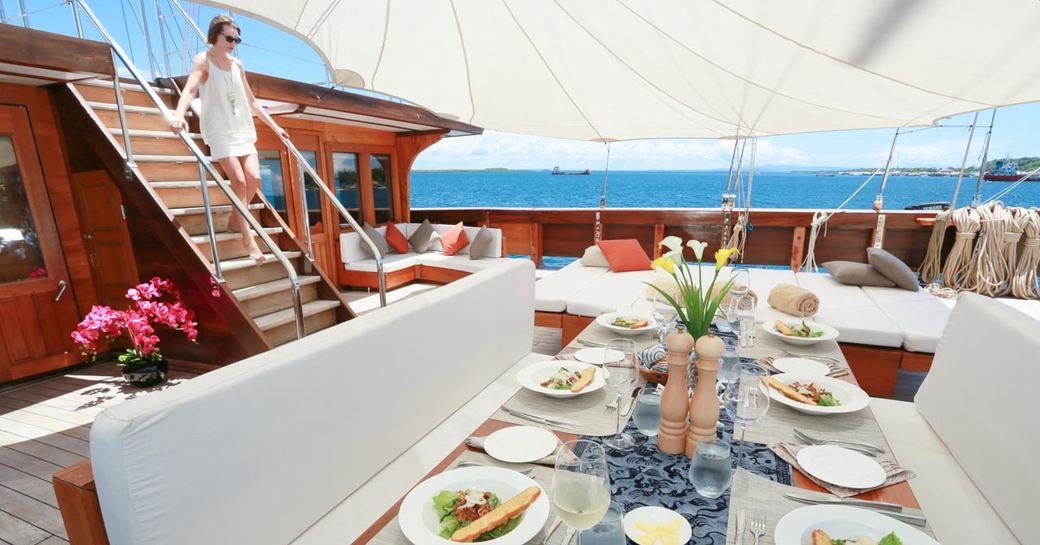 dinner is served on the foredeck alfresco dining area aboard charter yacht LAMIMA