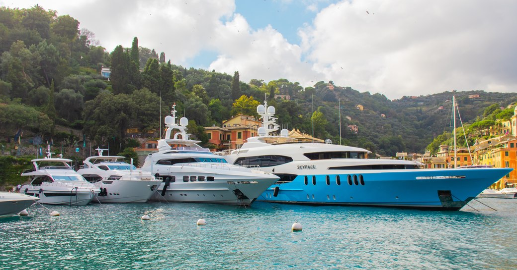 range of charter motor yachts docked at portofino,italy