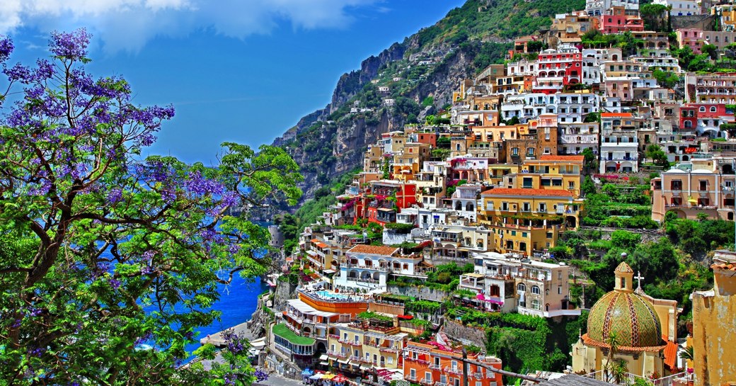 colourful buildings tumble down the hillside to the blue seas in Sorrento along the Amalfi Coast