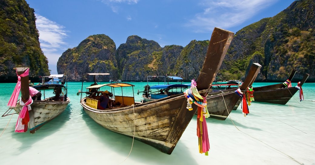 fishermen's boats on the shore of Ko Phi Phi in Thailand