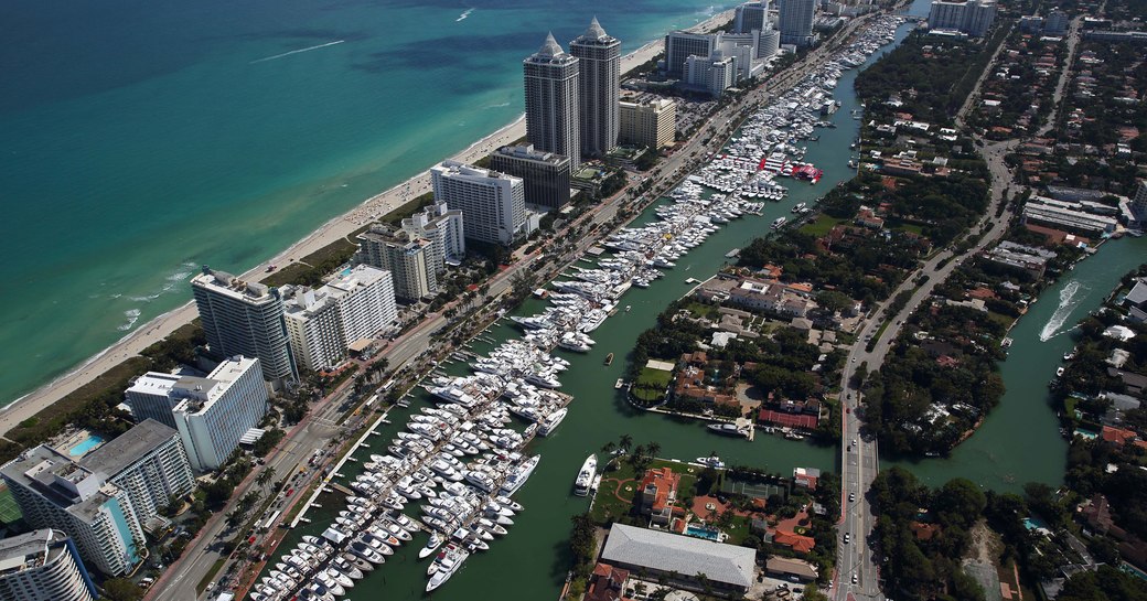 more than 500 yachts line up along Collins Avenue for the Miami Yacht Show