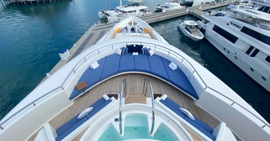 View from Jacuzzi to sunpads on superyacht Chasing Daylight