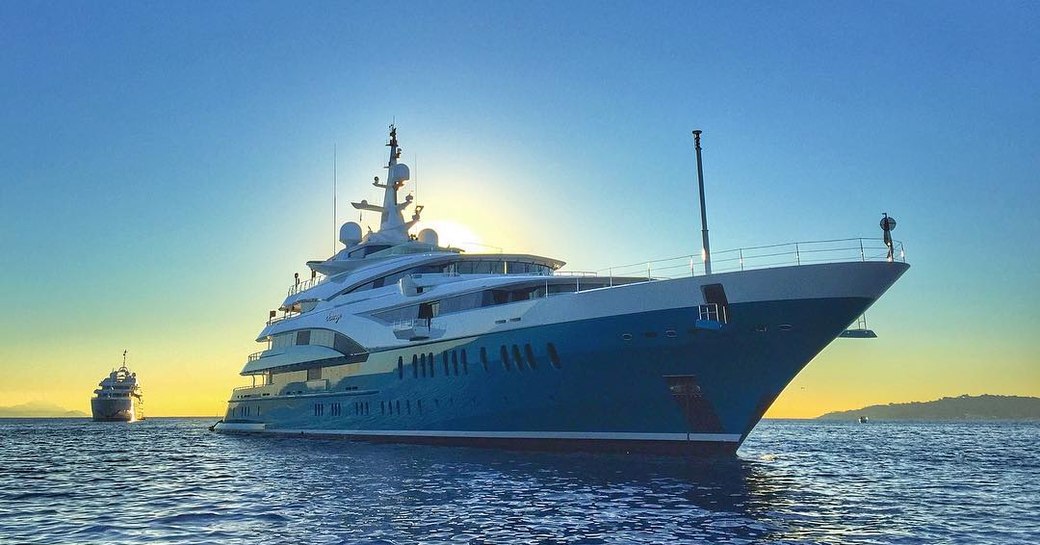 Superyacht SUNRAYS on calm sea at sunset