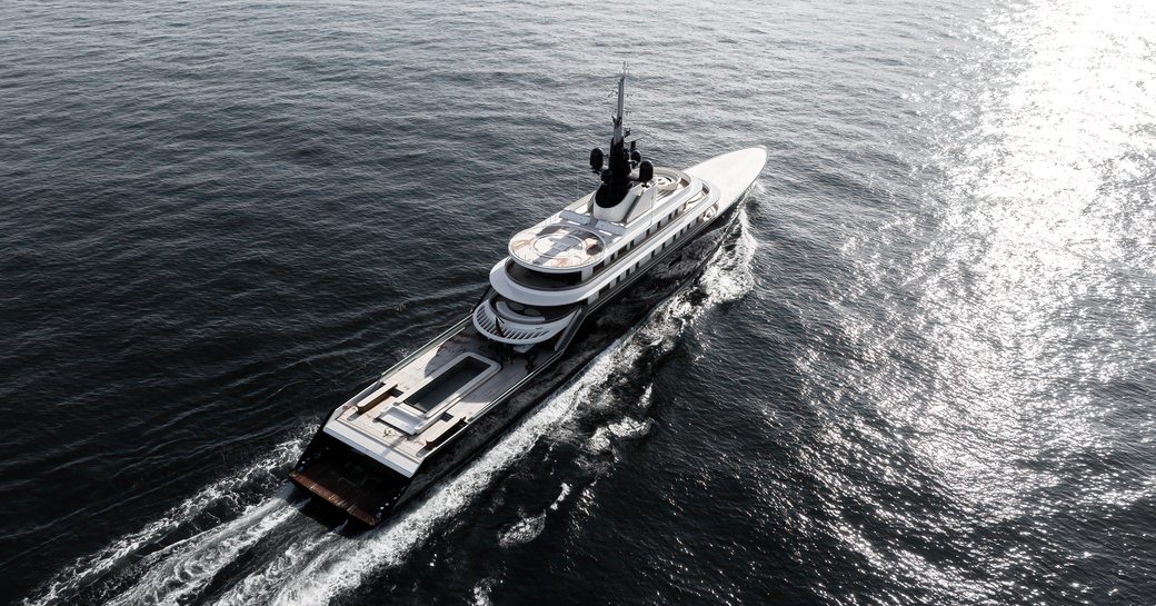 Aft aerial view looking down on charter yacht LIVA° underway, surrounded by sea.