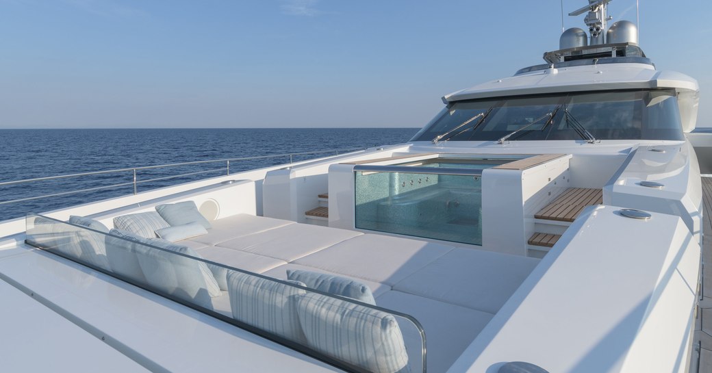 Sundeck with seating and Jacuzzi on superyacht EIV