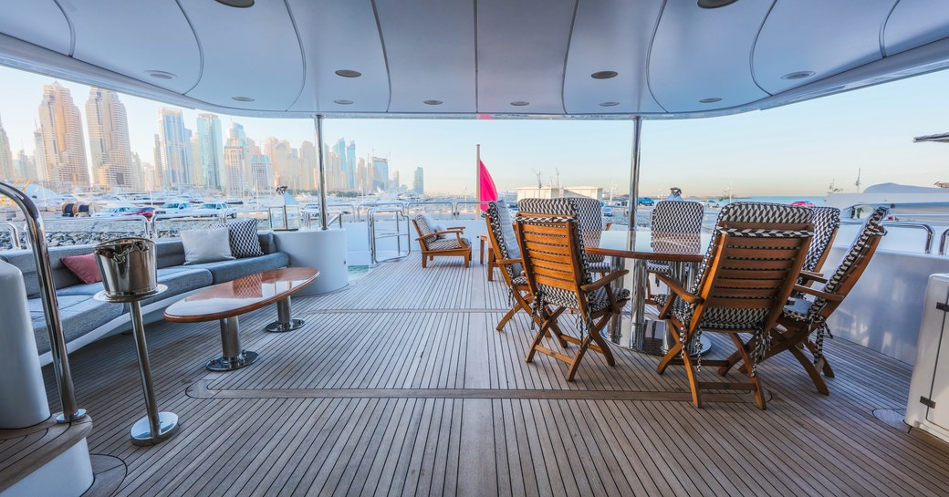 seating and casual dining area under the radar arch on the sundeck aboard luxury yacht DXB 