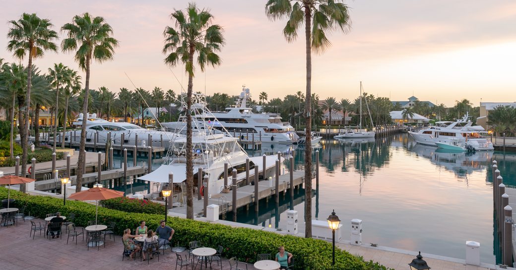 Overview of the Atlantis marina in the Bahamas, with several motor yachts berthed 