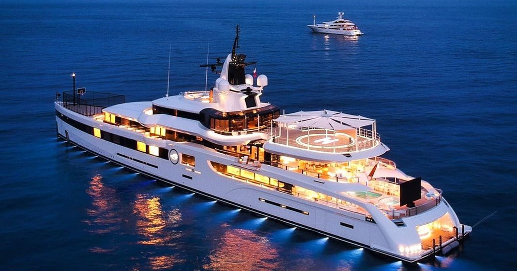 Superyacht Lady S at night on water