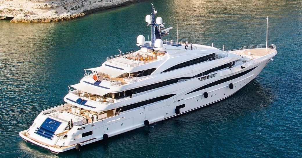 Luxury yacht 'Cloud 9' close to a green coast