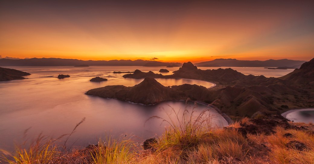 sun sets over the beautiful landscape of Komodo