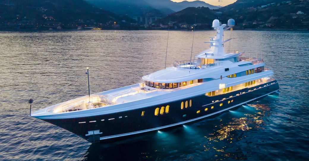 Charter yacht KAISER at anchor at dusk