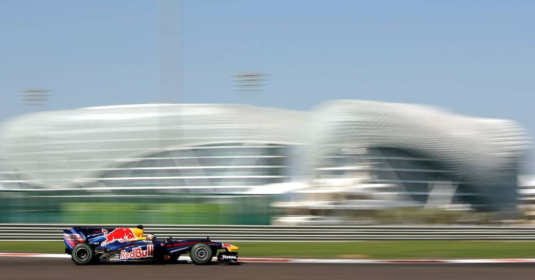 Race car on Yas Marina Circuit going past Yas Viceroy during Abu Dhabi Grand Prix