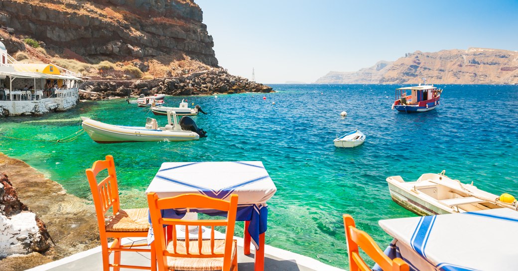 Santorini restaurant in a quiet harbour, Greece